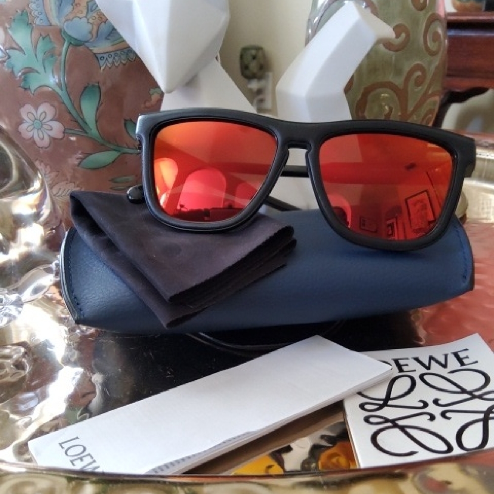 Loewe Unisex Black Sunglasses with Vibrant Red/Mirrored Lenses.